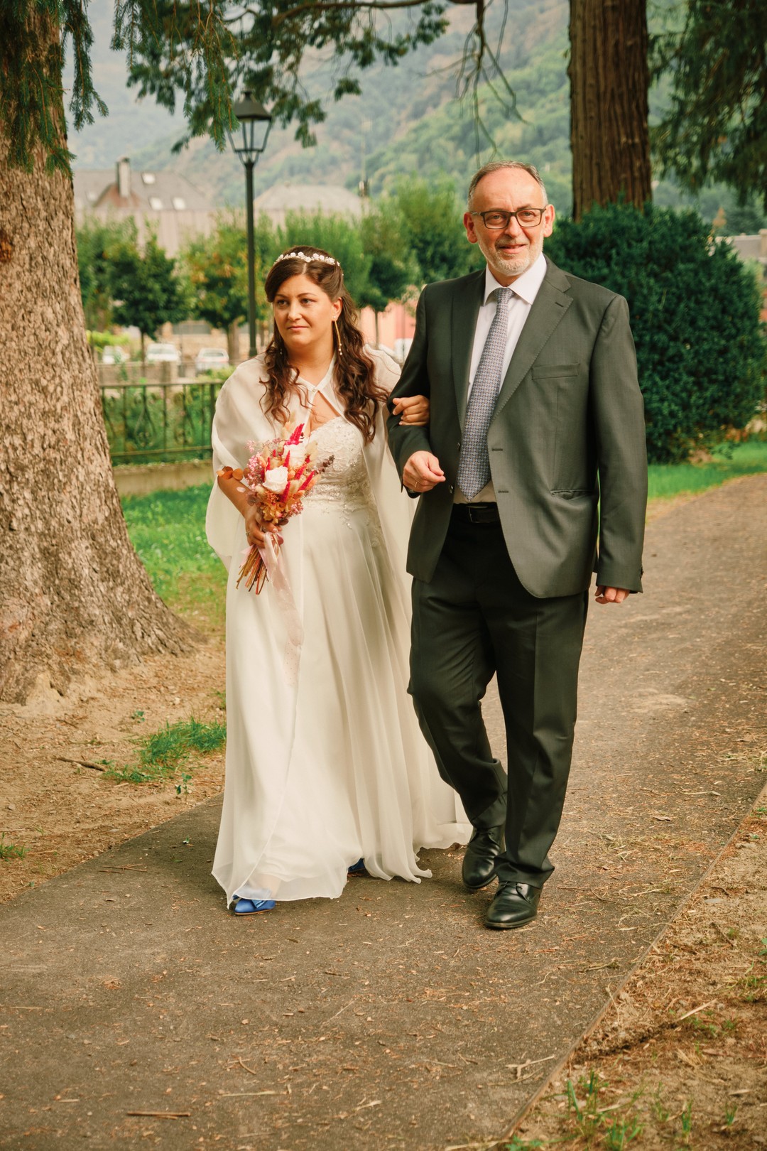 Miriam arrives at the ceremony with a loved one.