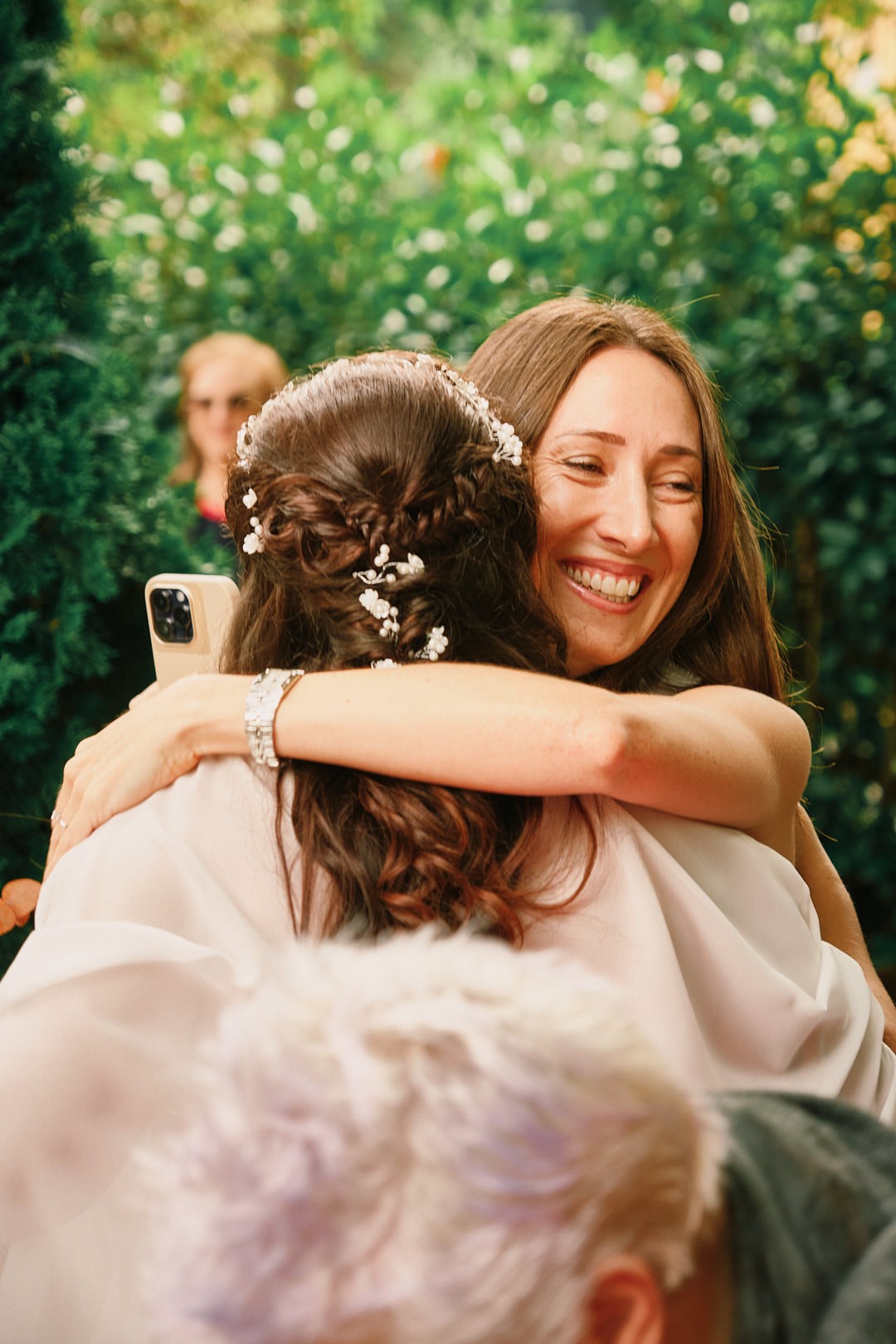 Miriam embraces a guest after the ceremony.