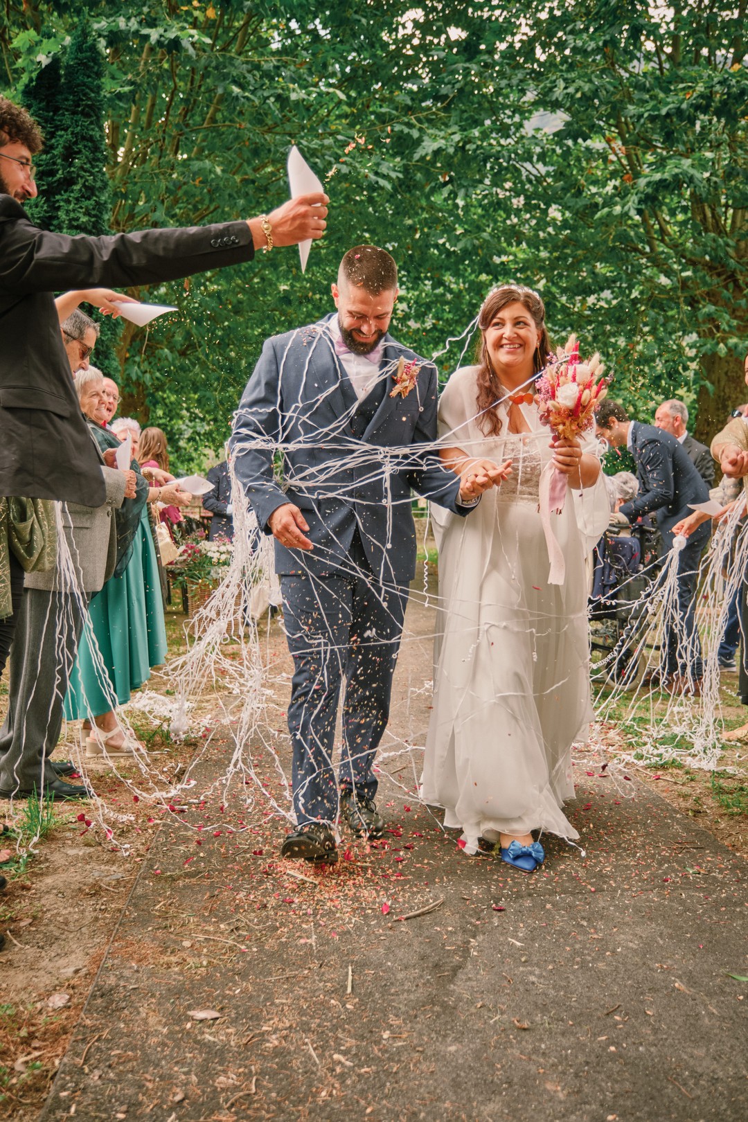 Miriam and Alejandro walk through the guests as they leave the ceremony.