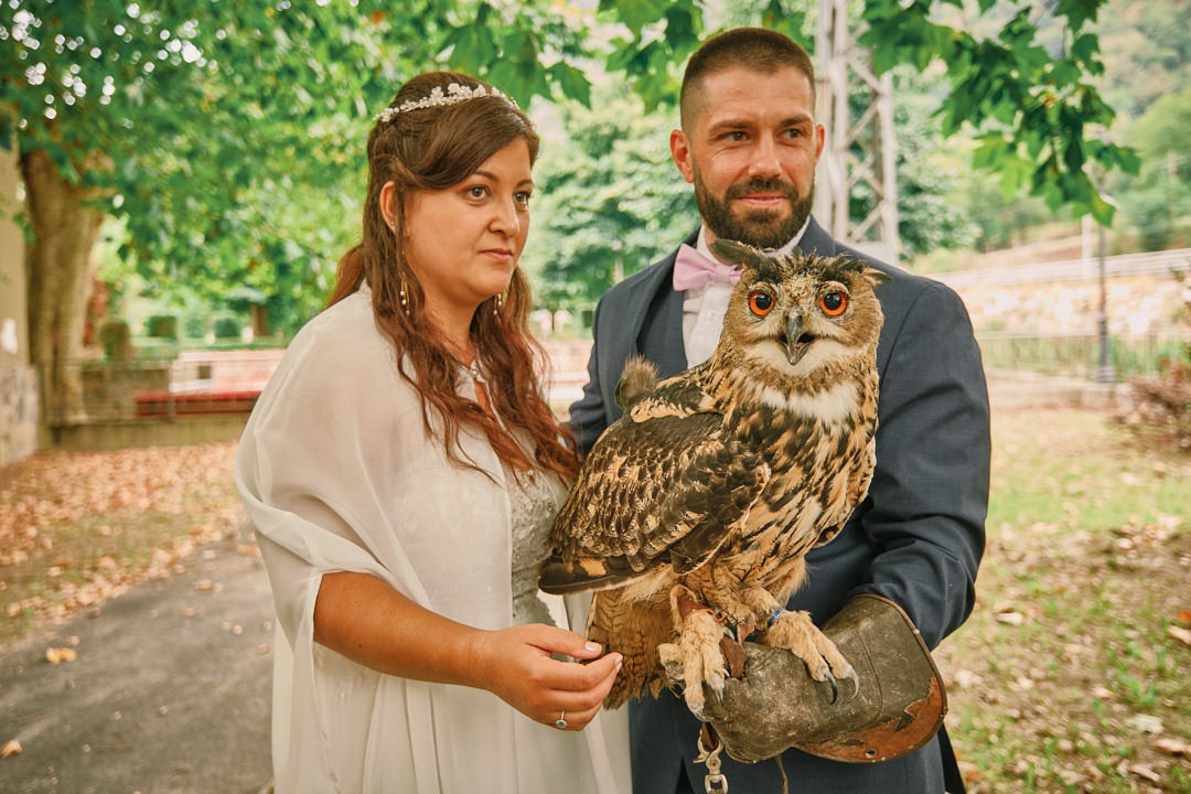 Miriam and Alejandro pose with an owl during the celebration.