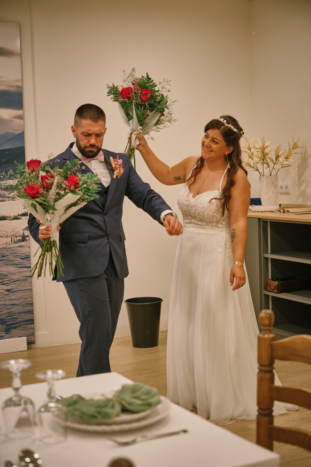 Miriam and Alejandro enter the reception room together.