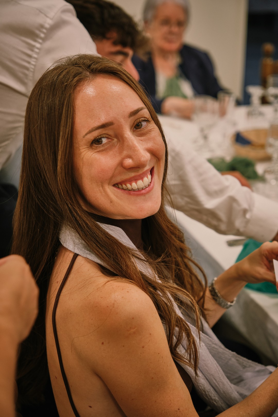 A smiling guest during the meal.