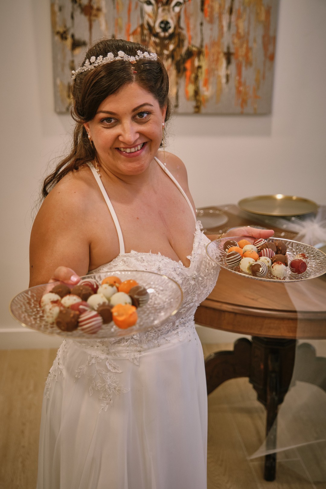 Miriam presents a dessert with a smile.