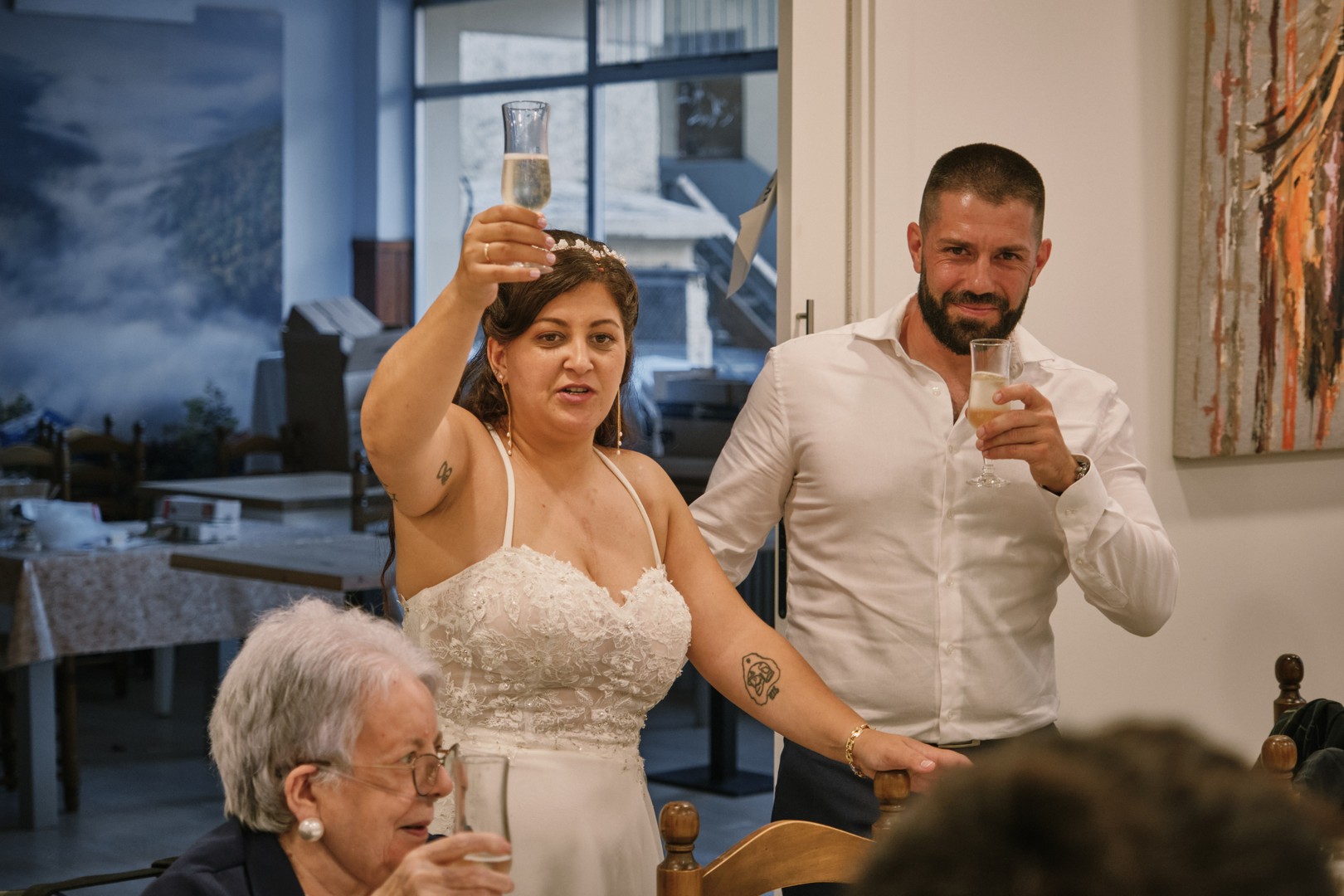 Miriam and Alejandro raise their glasses during the reception.