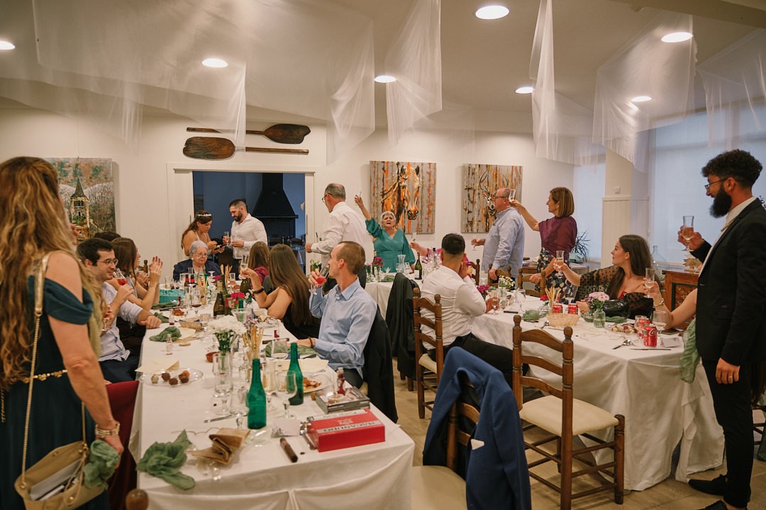 Guests gathered around the tables at the wedding dinner.