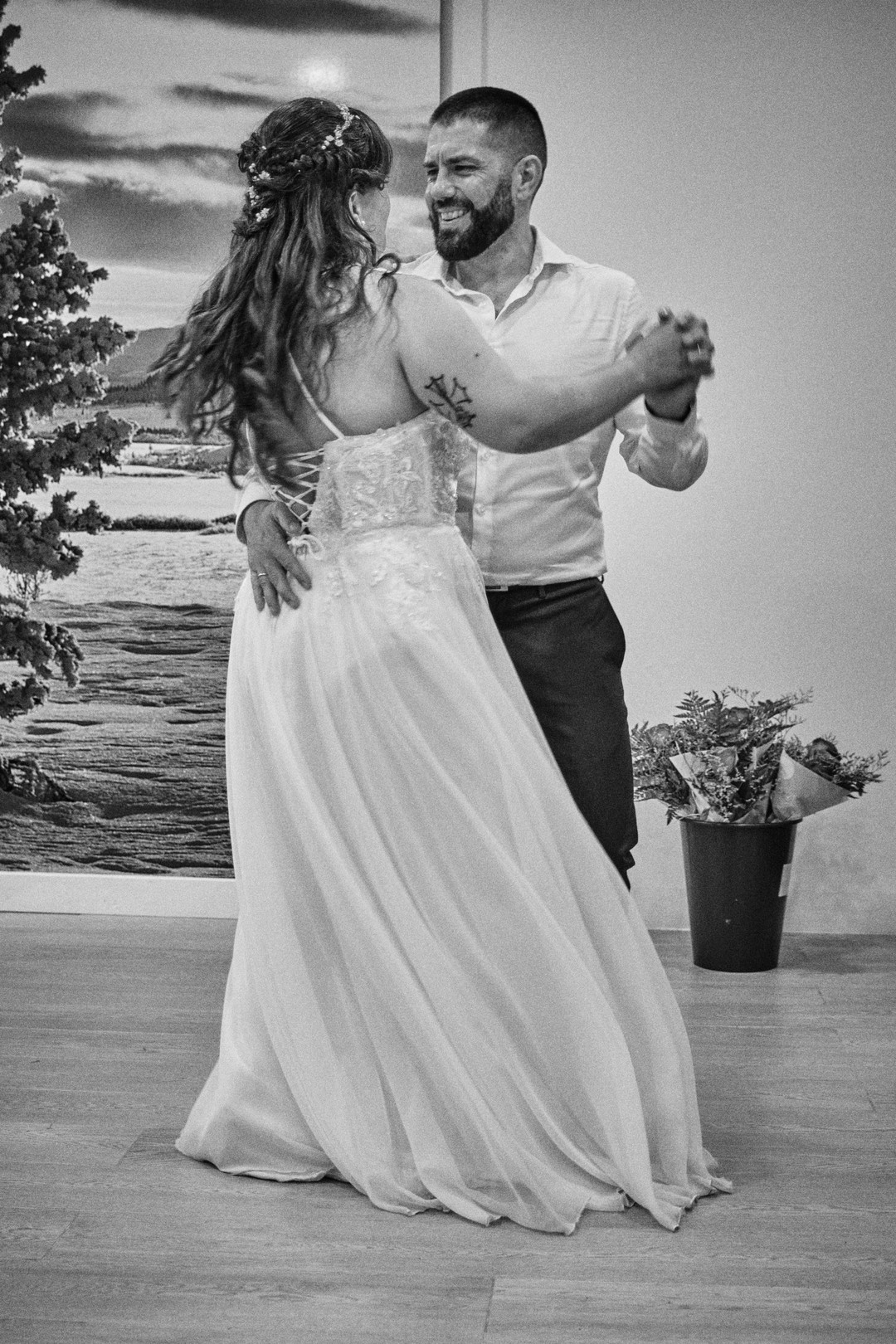 Miriam and Alejandro dance together, in black and white.